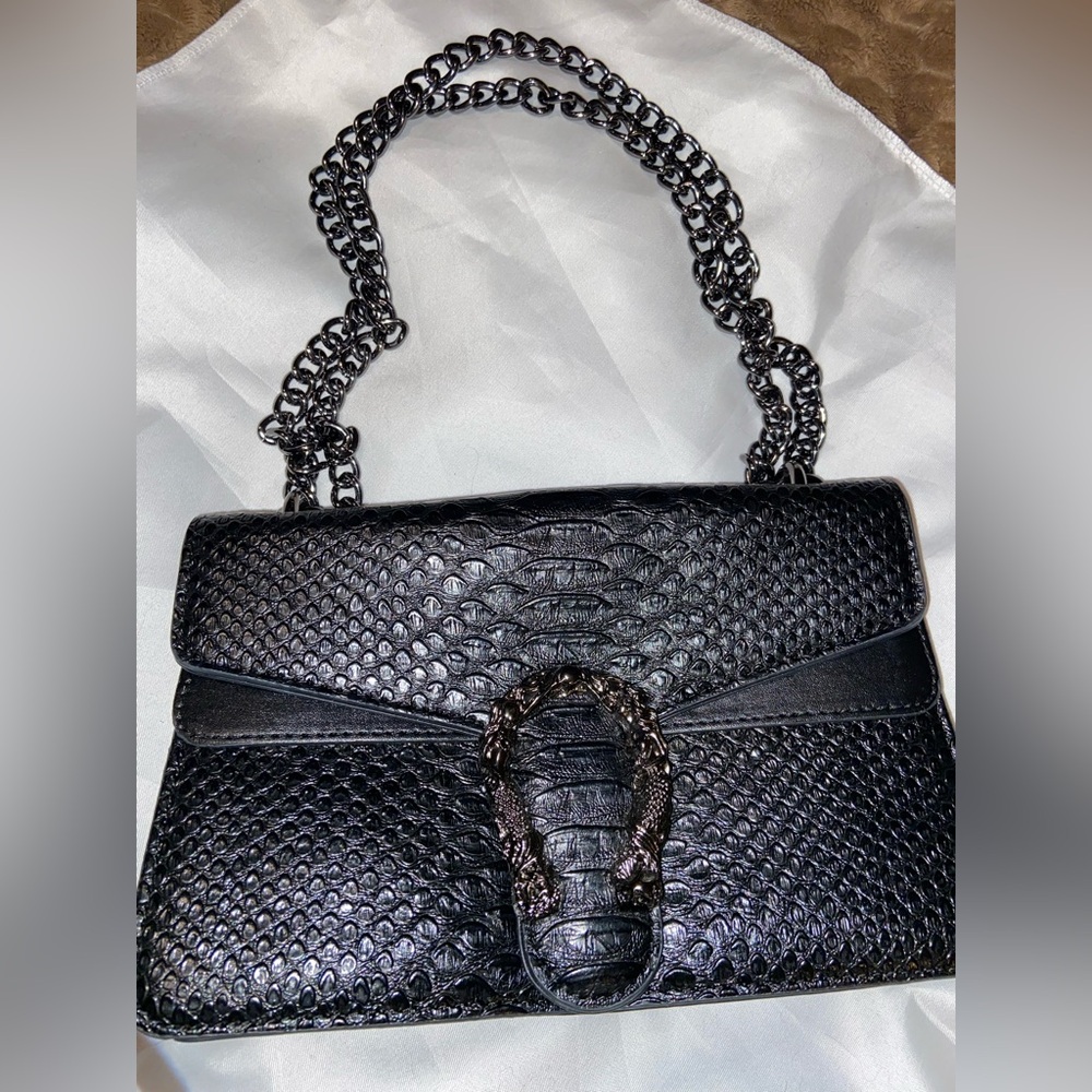 Black embossed faux leather bag with Greek metal decor and heavy metal chain